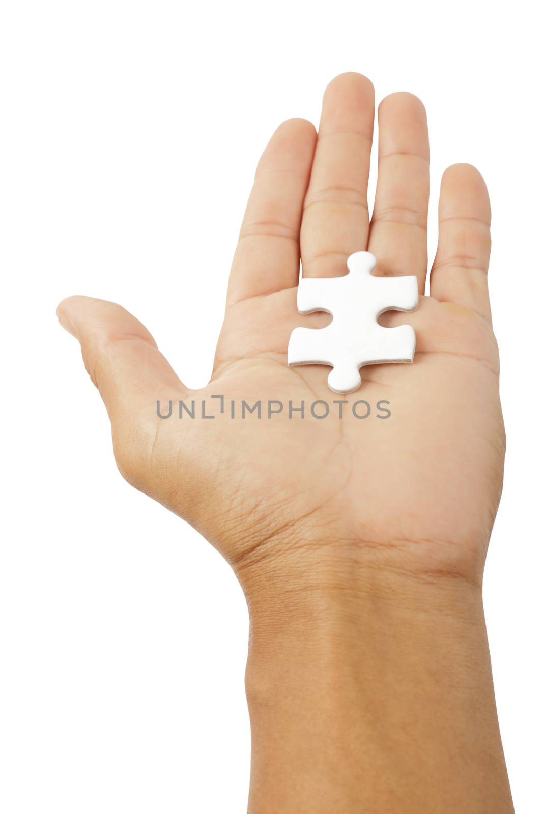 Male hand holding white puzzle isolated on white background, clipping path.