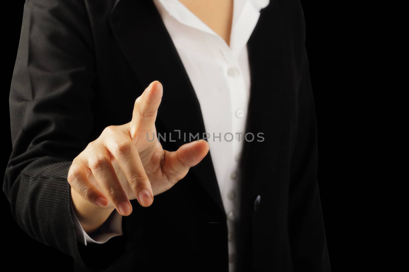 Businesswoman hand pointing finger isolated on black background, clipping path.