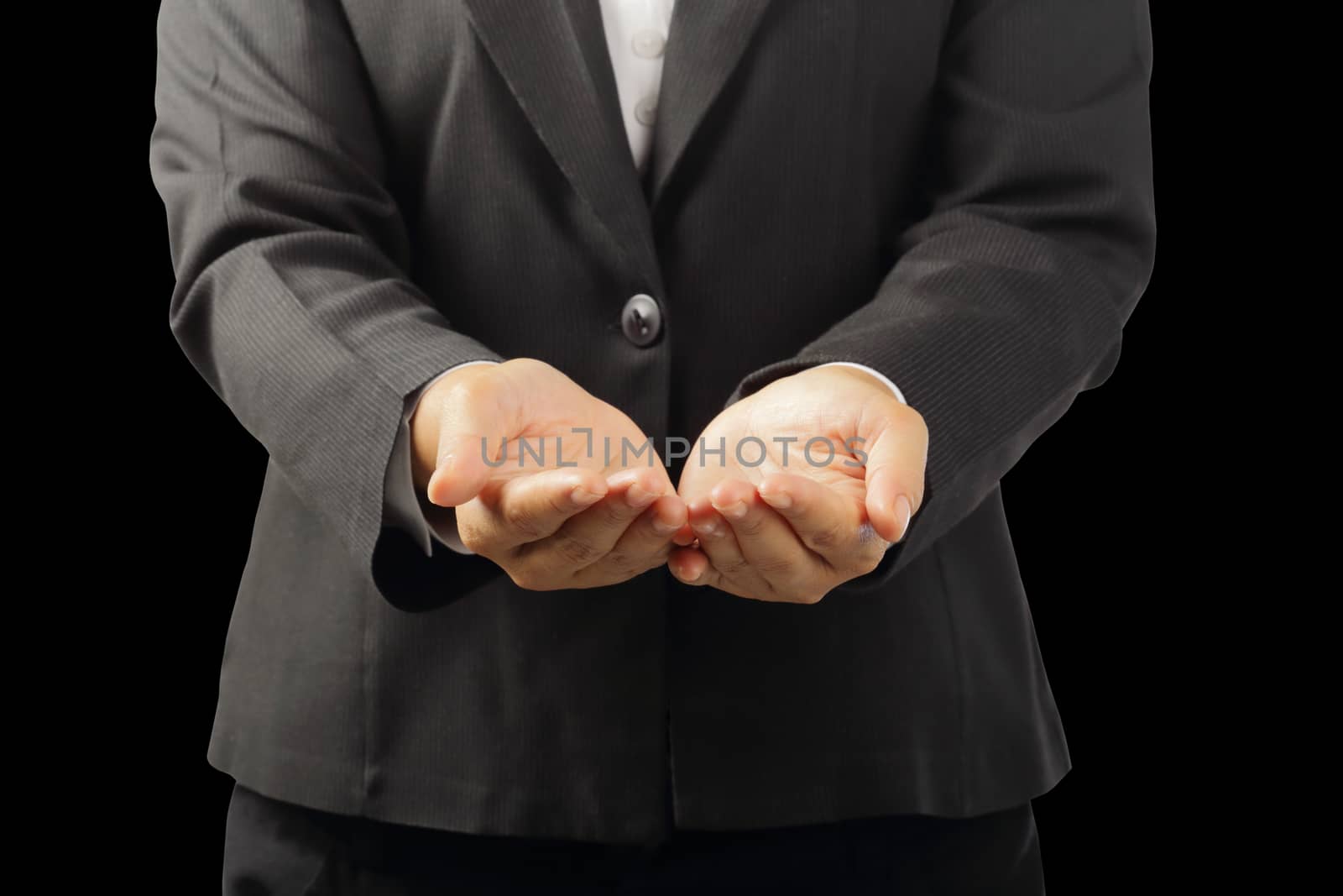 Businessman's hands to showing something isolated on black background with clipping path, concept advertisement product.