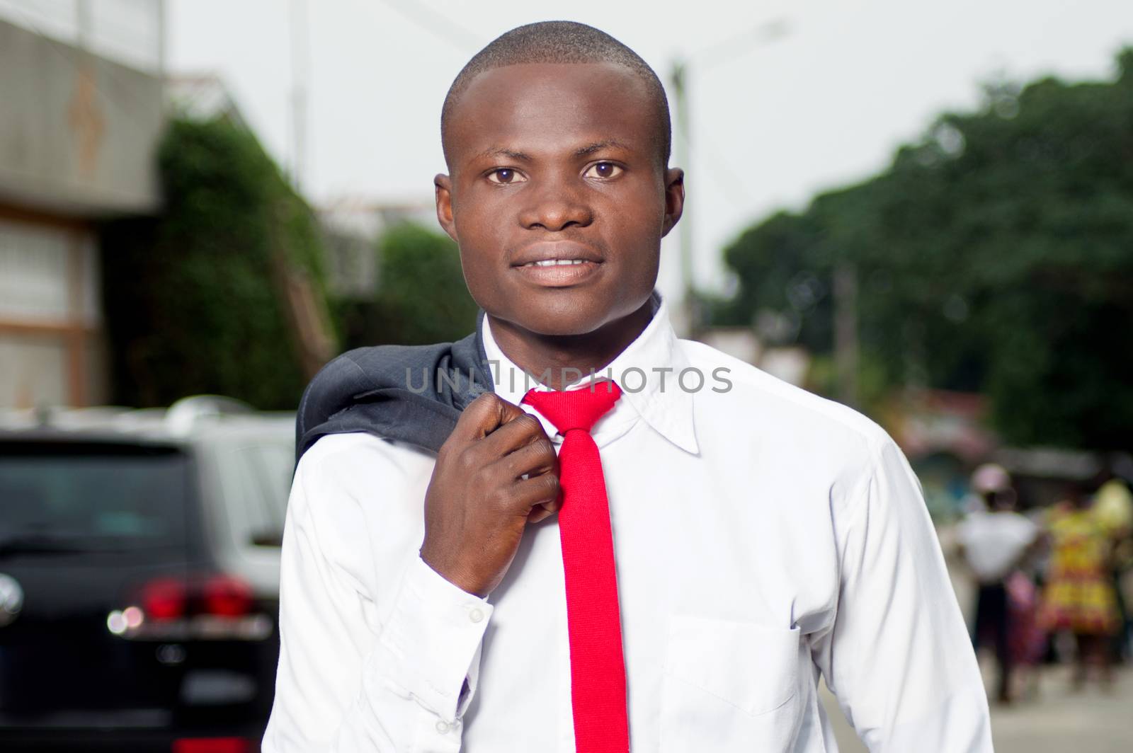 Portrait of young African businessman leaving in the morning for work.