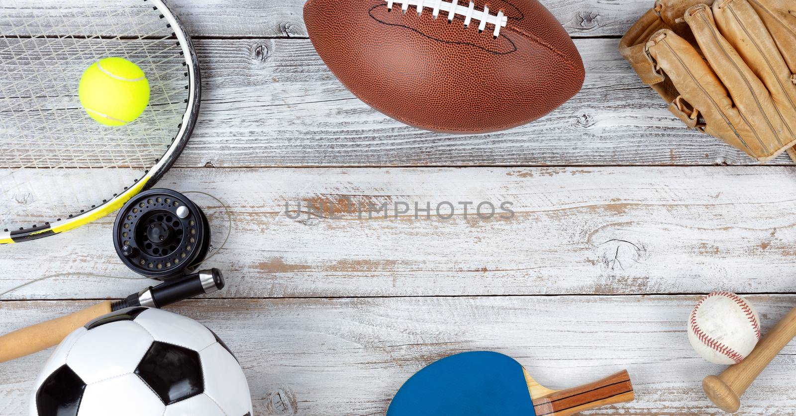 Various sports equipment on white rustic wooden background by tab1962