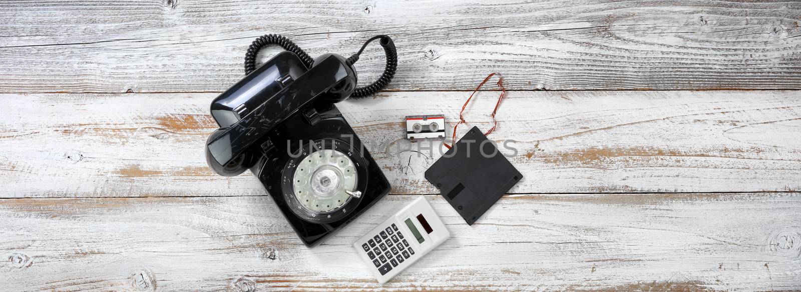 Vintage technology includes rotary dial phone and old data storage devices