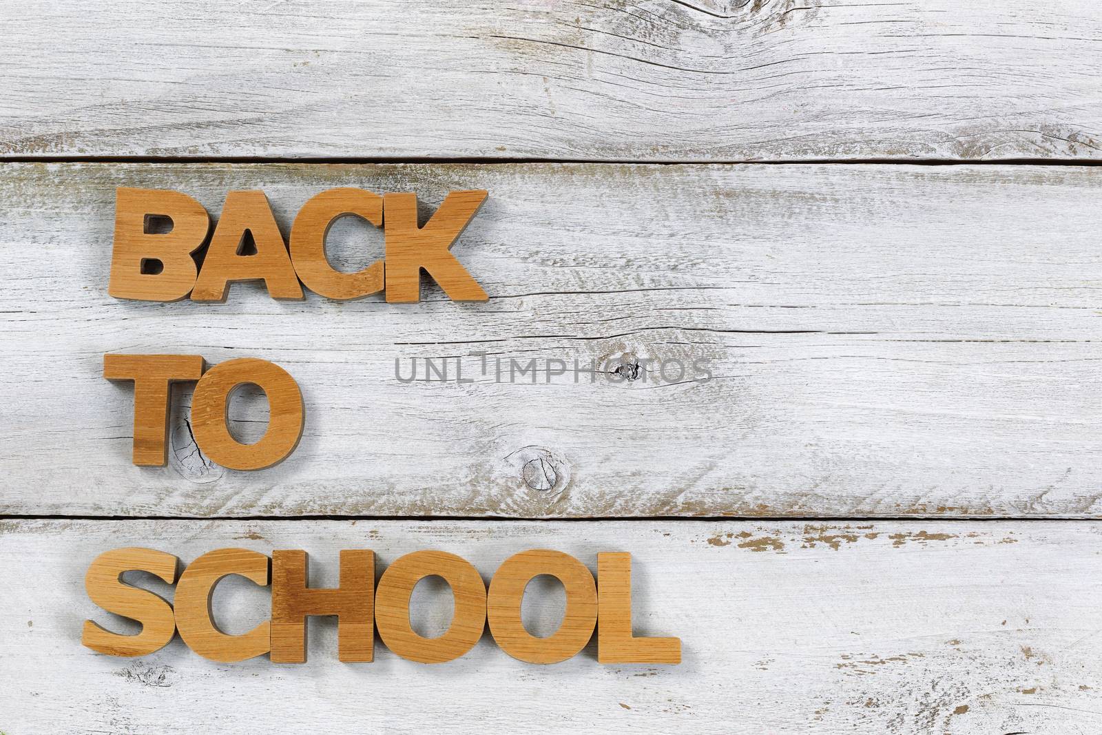 Back to school letters on old white wooden boards by tab1962