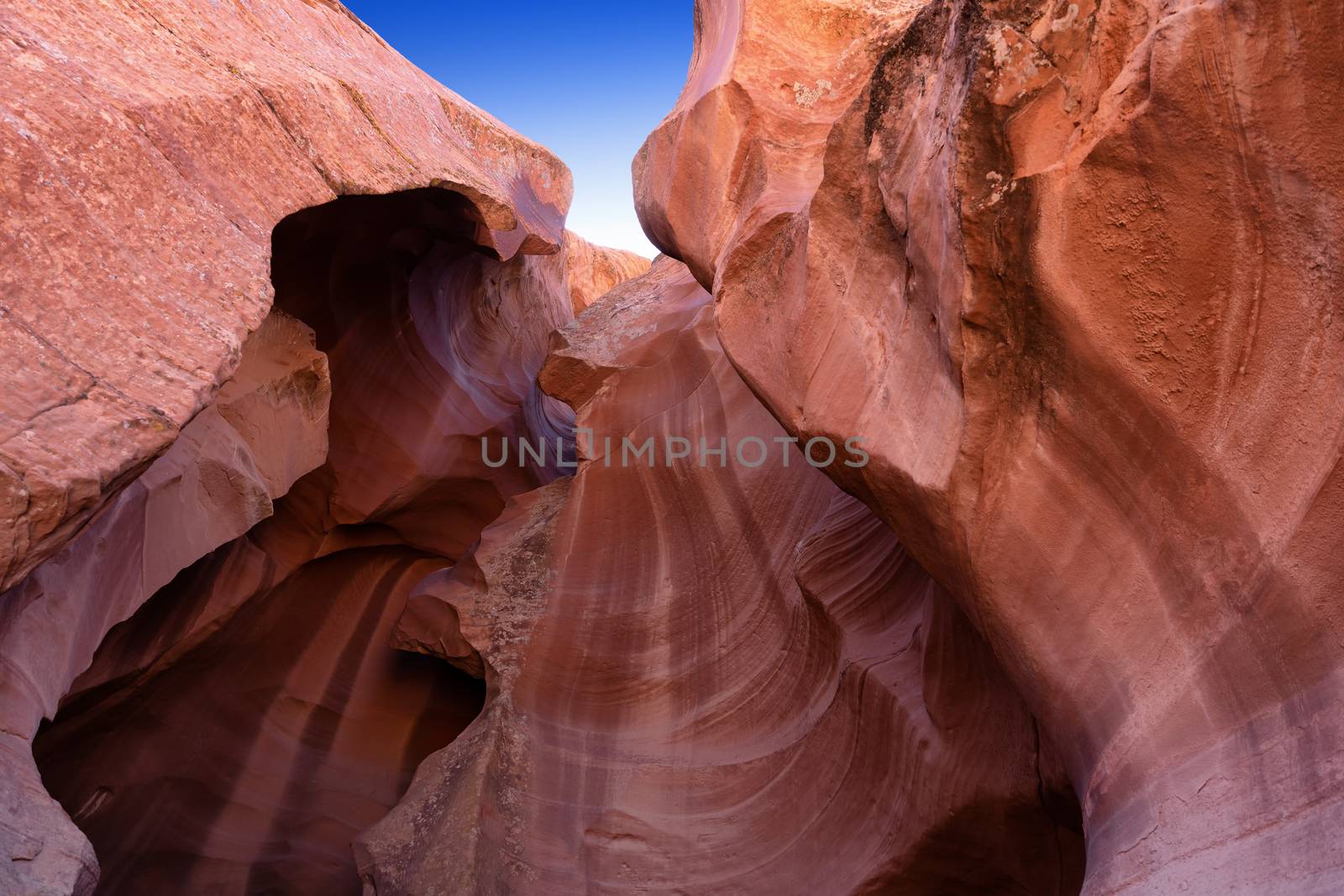 Upward view of Antelope Canyon in Arizona with blue sky