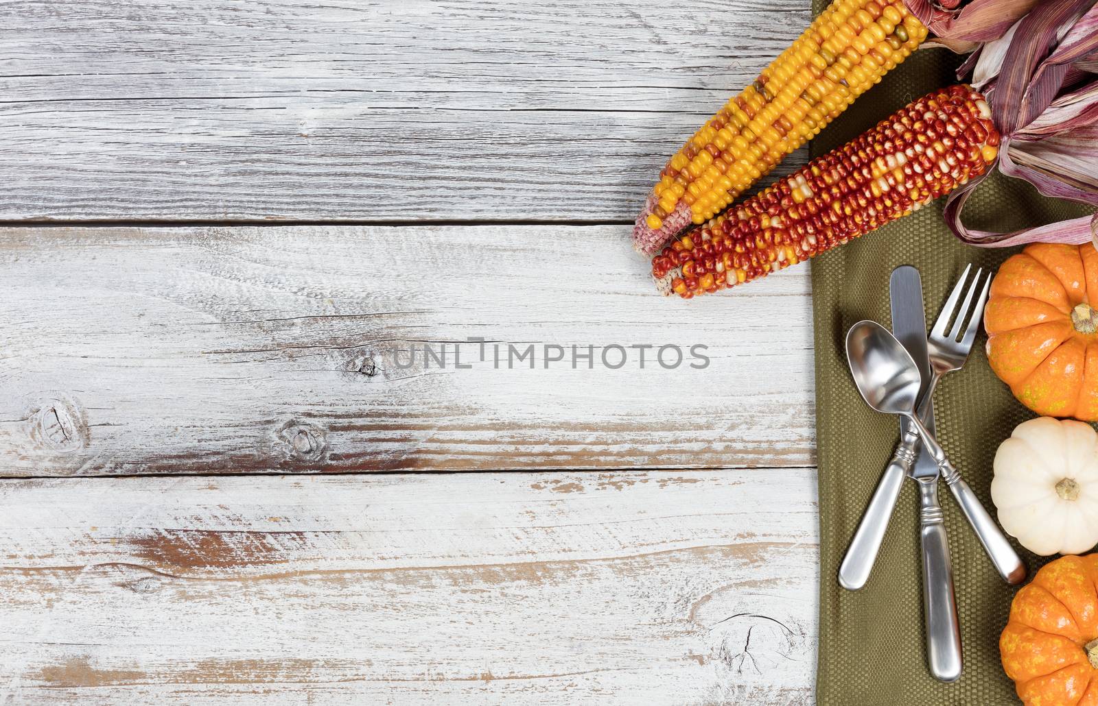 Thanksgiving dinner setting on rustic white table with colorful  by tab1962