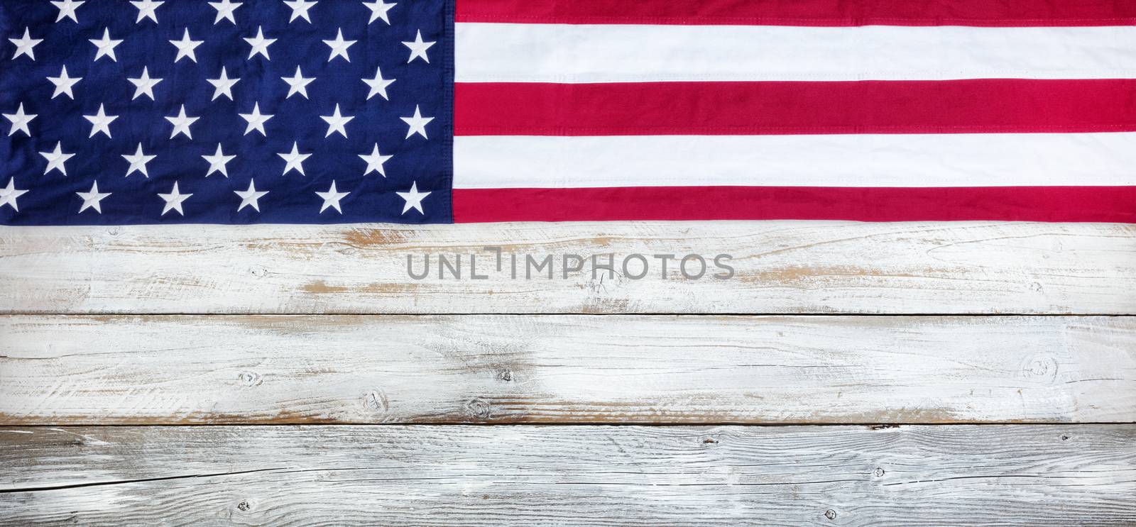 Cloth United States flag on white vintage wood plank background  by tab1962