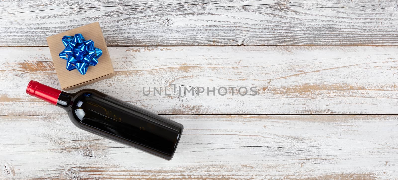 Happy fathers day concept with red wine and dress tie on white wooden background 