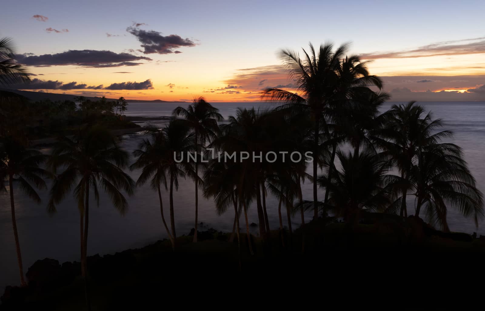 Tropical ocean with fading sunset during late evening 