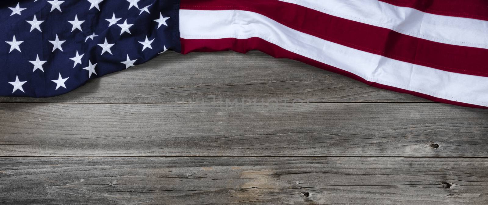 United States of America flag forming upper border on rustic wooden boards 