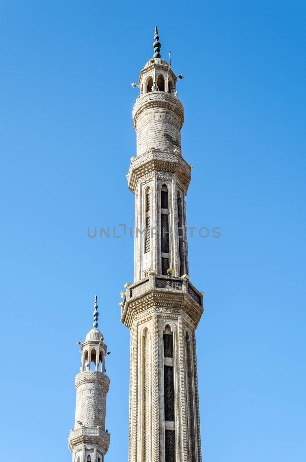 two minarets of the mosque El-Mustafa in Sharm El Sheikh on the background of the blue sky Egypt South Sinai