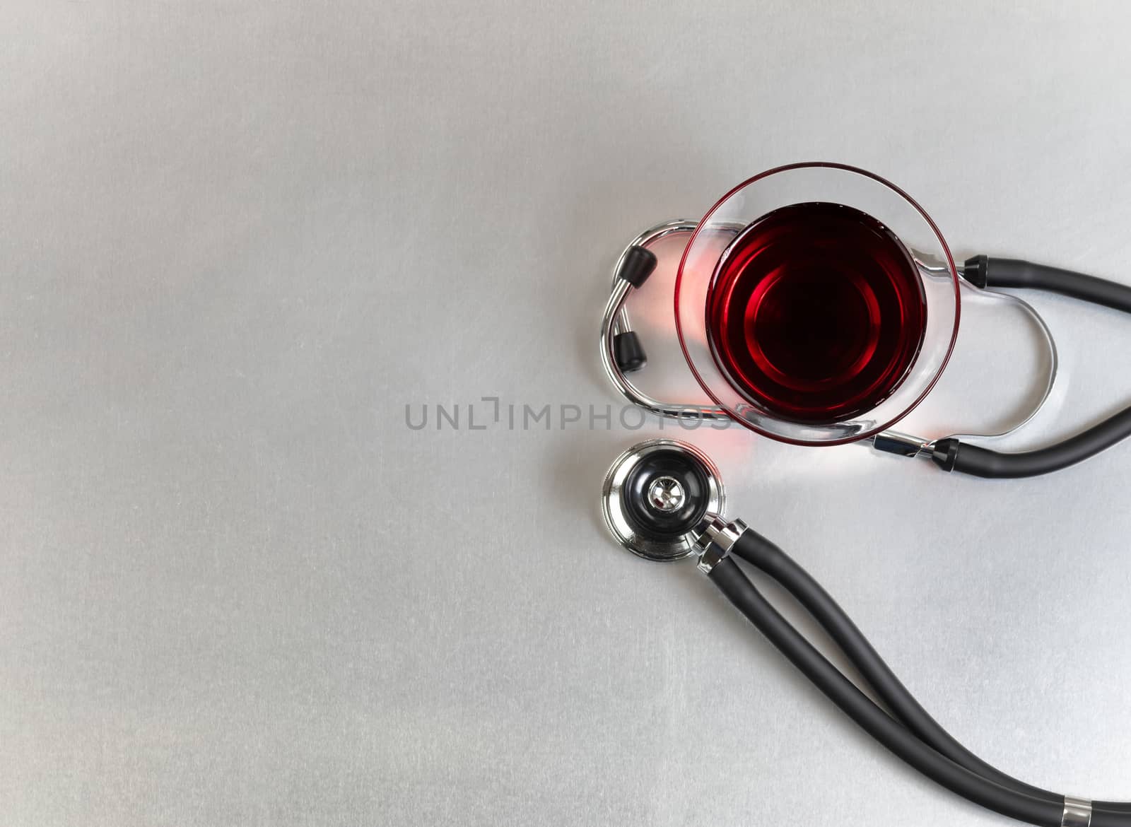 Red wine for alternative medicine on medical table 