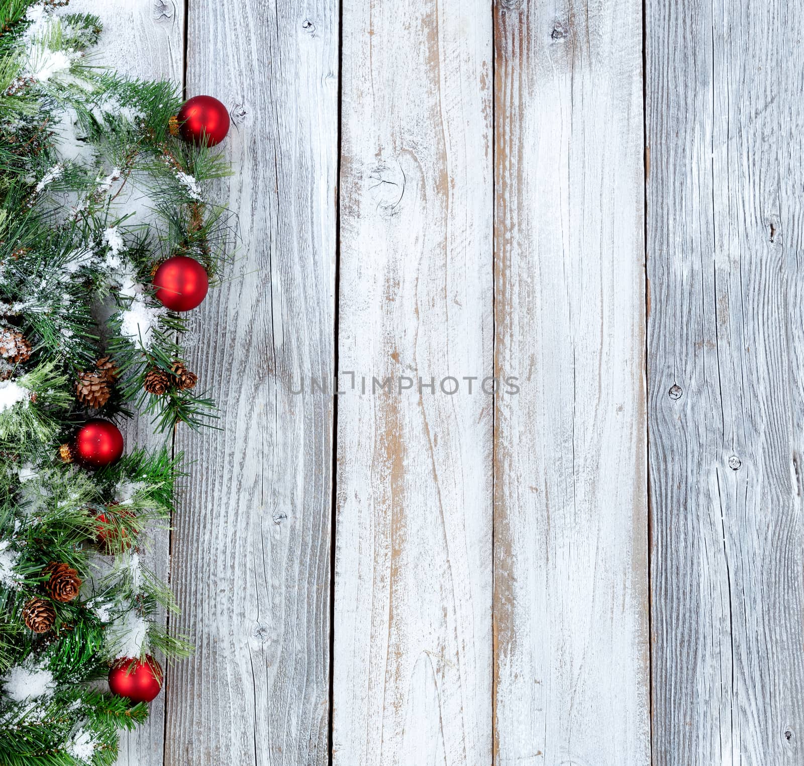 Christmas background with snowy evergreen branches and red ornam by tab1962