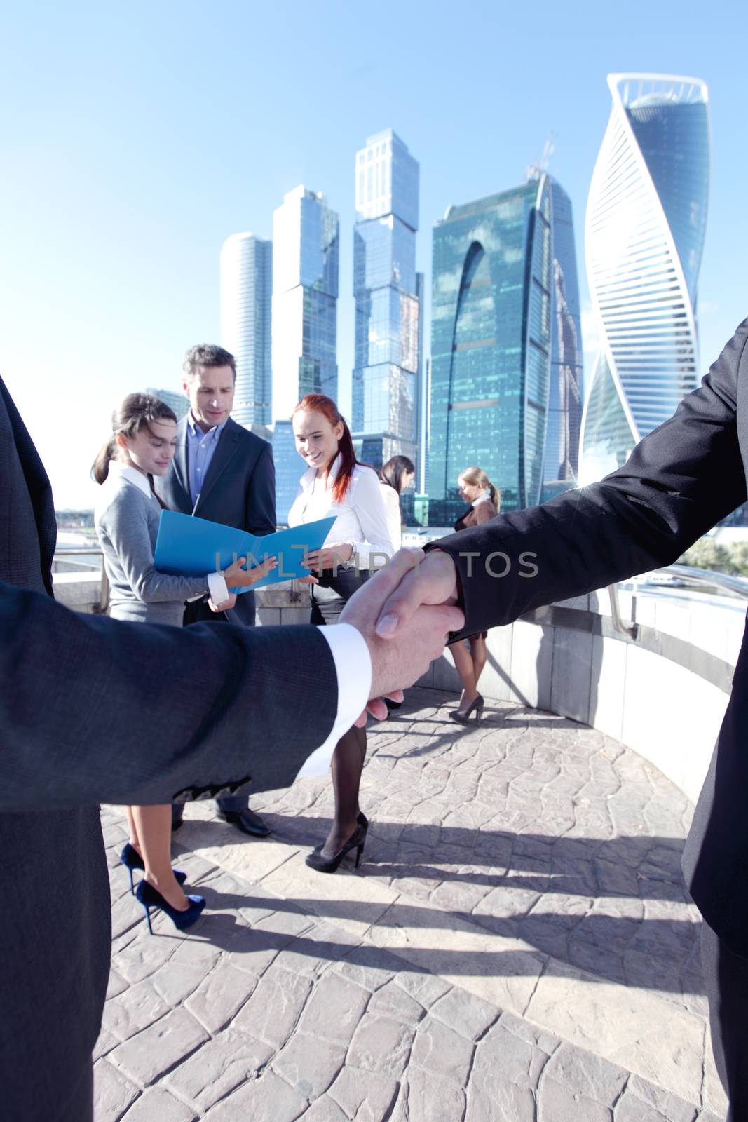 Business people meeting outdoors by ALotOfPeople