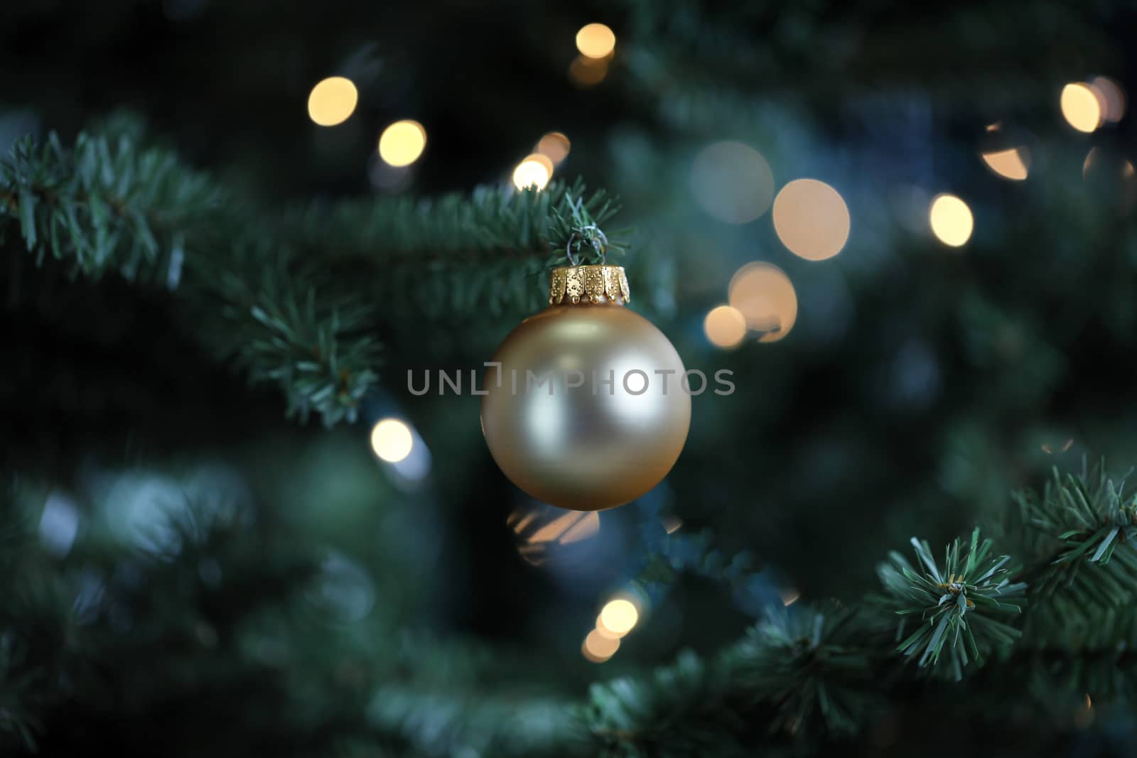 Traditional artificial Christmas tree with gold ball ornament an by tab1962