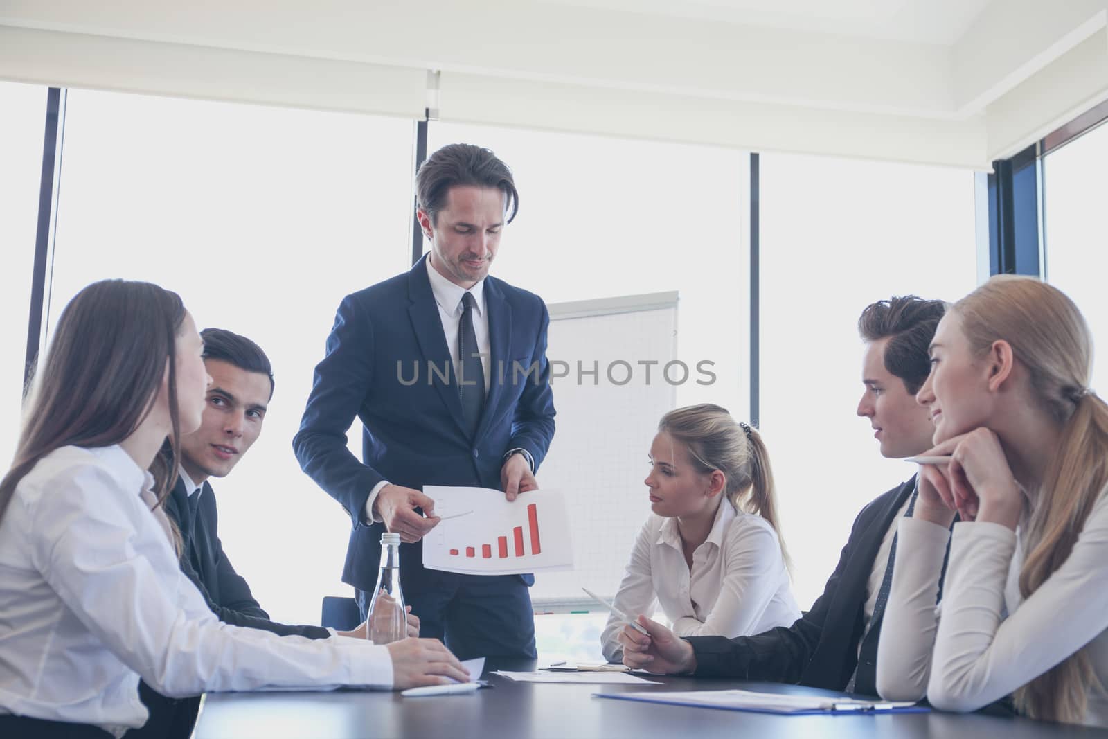 Business man showing diagram during the presentation at office