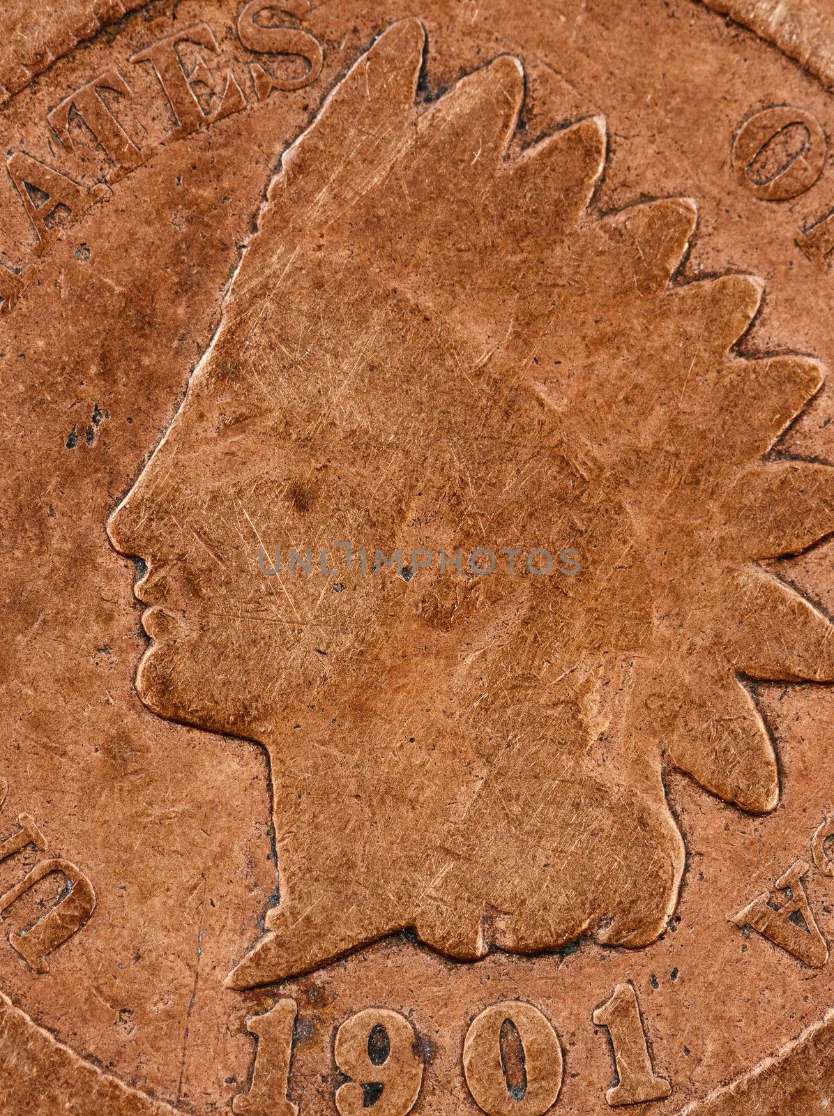 Macro view of toned copper metal coin that is aged 