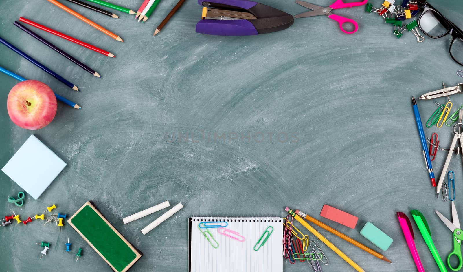  Back to school concept with green chalkboard and a variety of s by tab1962