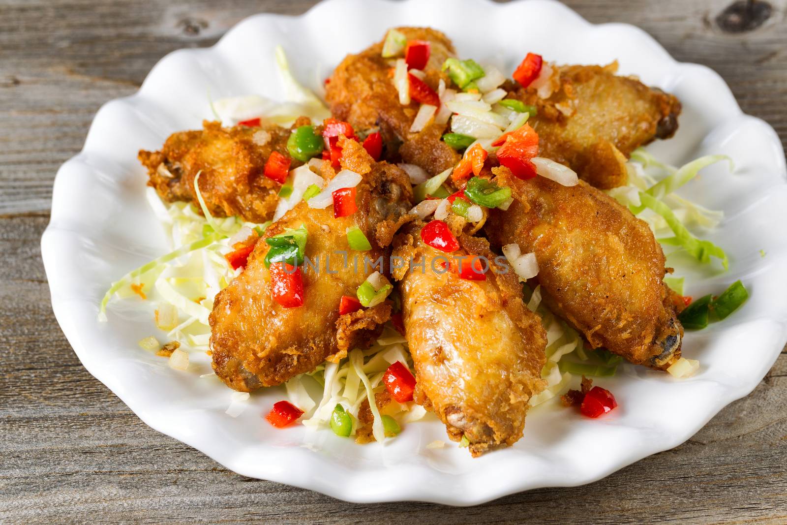 Chicken wings in white plate ready to eat  by tab1962