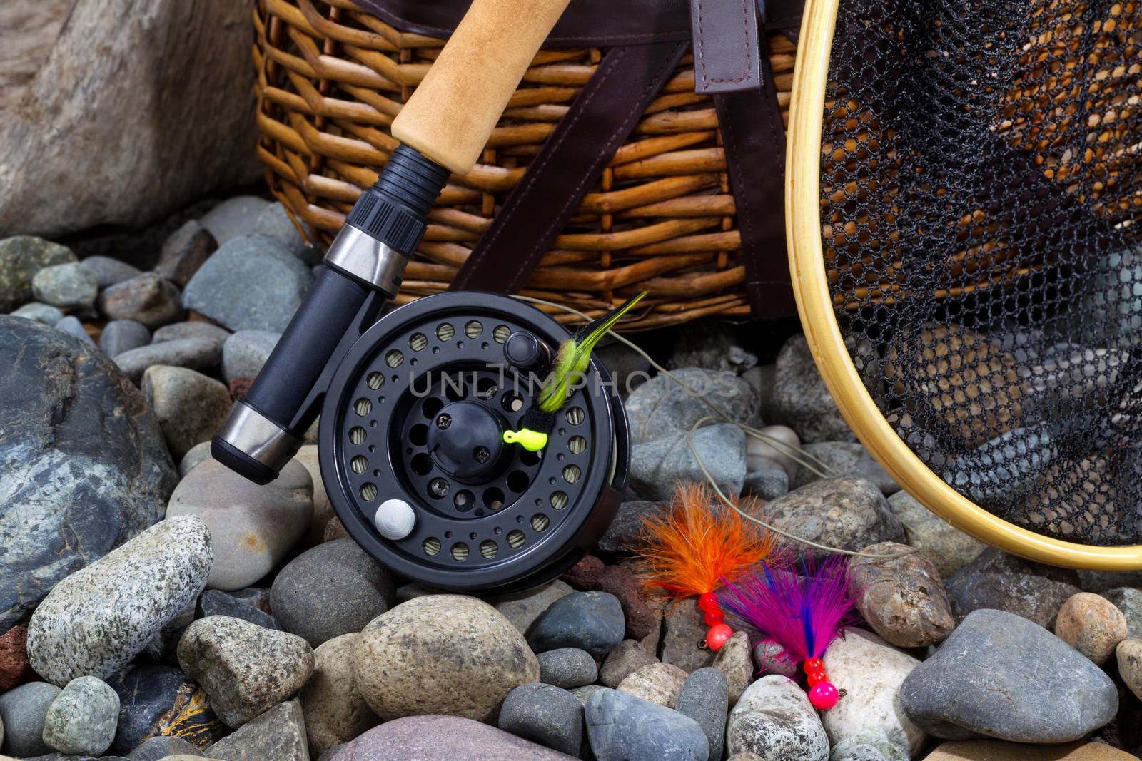 Fishing Gear on River Bed Rocks  by tab1962