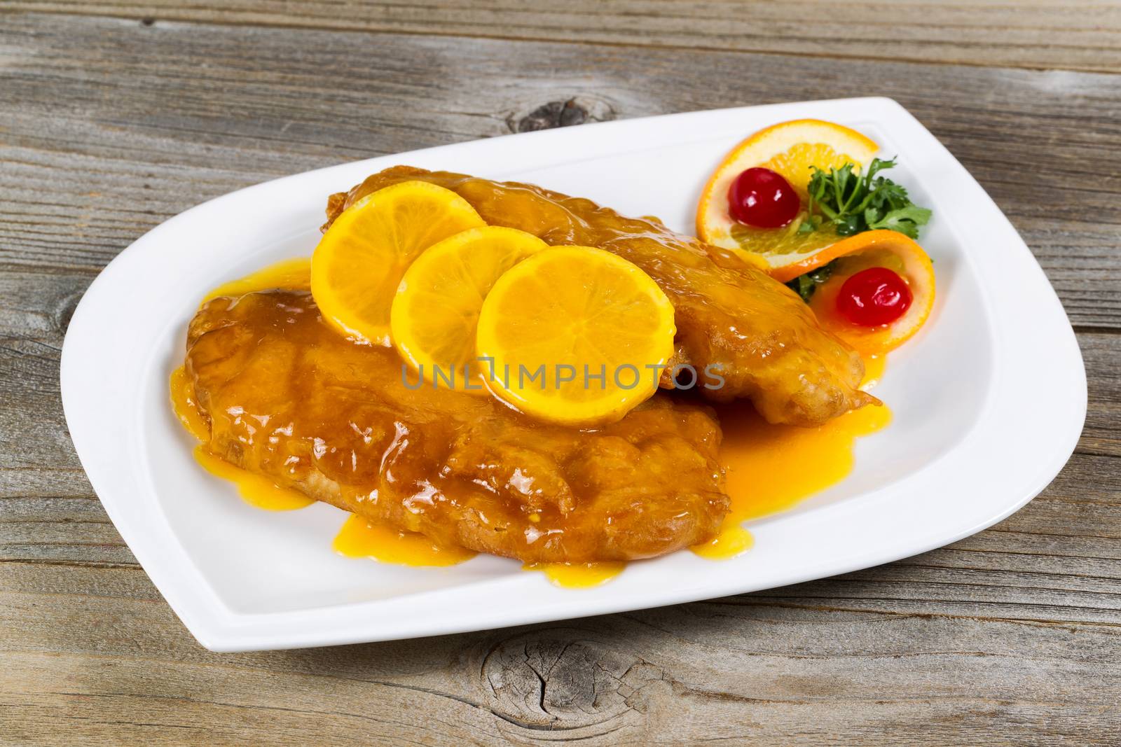 Fried chicken with lemon sauce ready to eat by tab1962