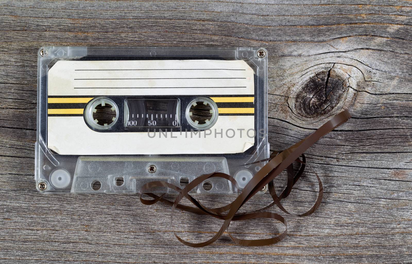 Old Cassette Tape Cartridge on rustic wood