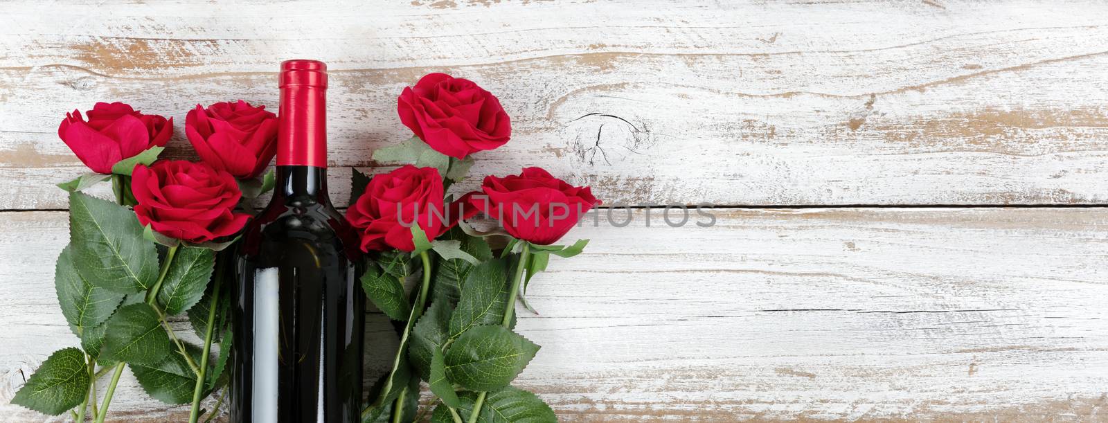 Valentines Day celebration with red wine and roses on white rust by tab1962