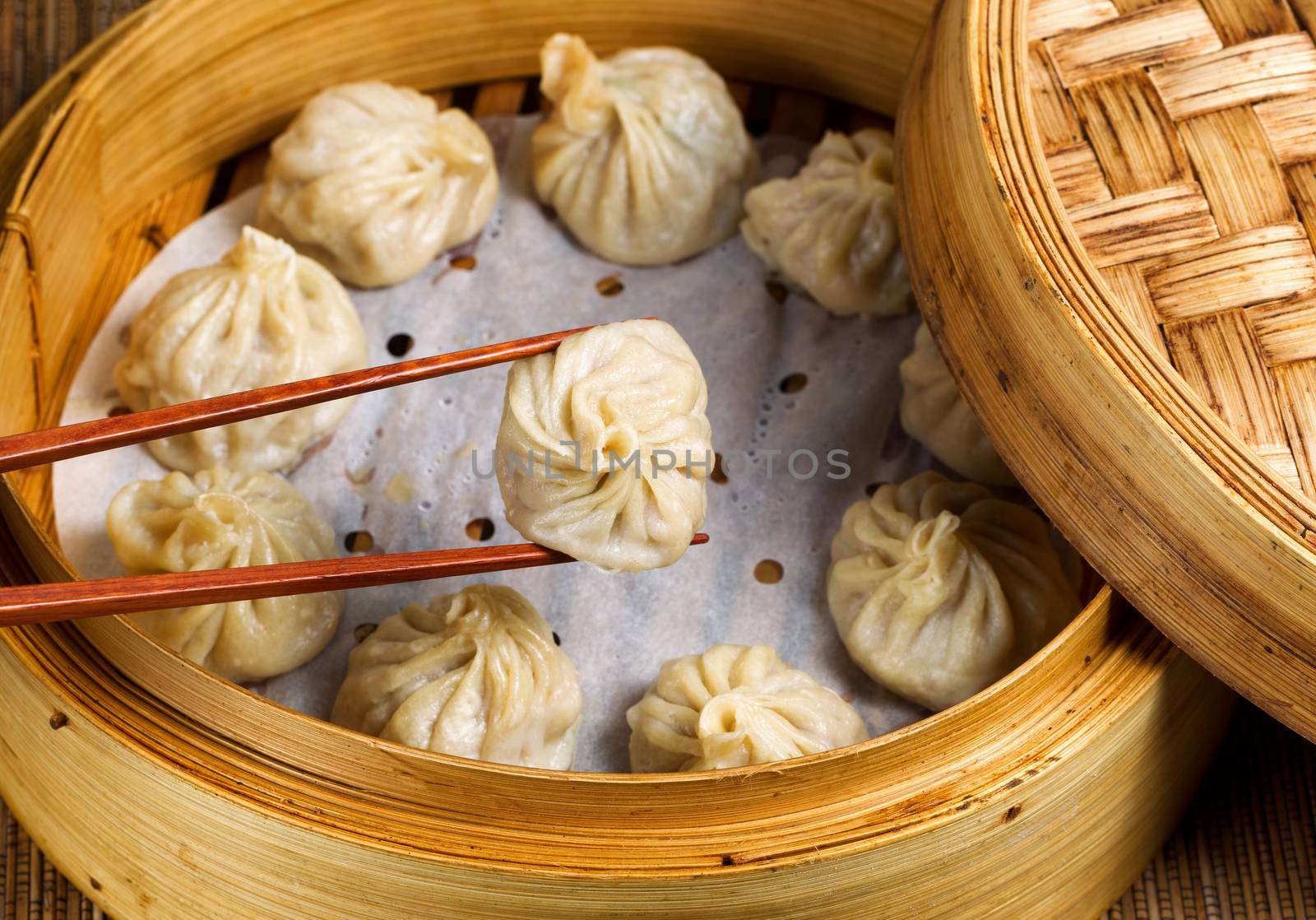 Freshly steamed Chinese dumplings out of bamboo steamer ready to by tab1962