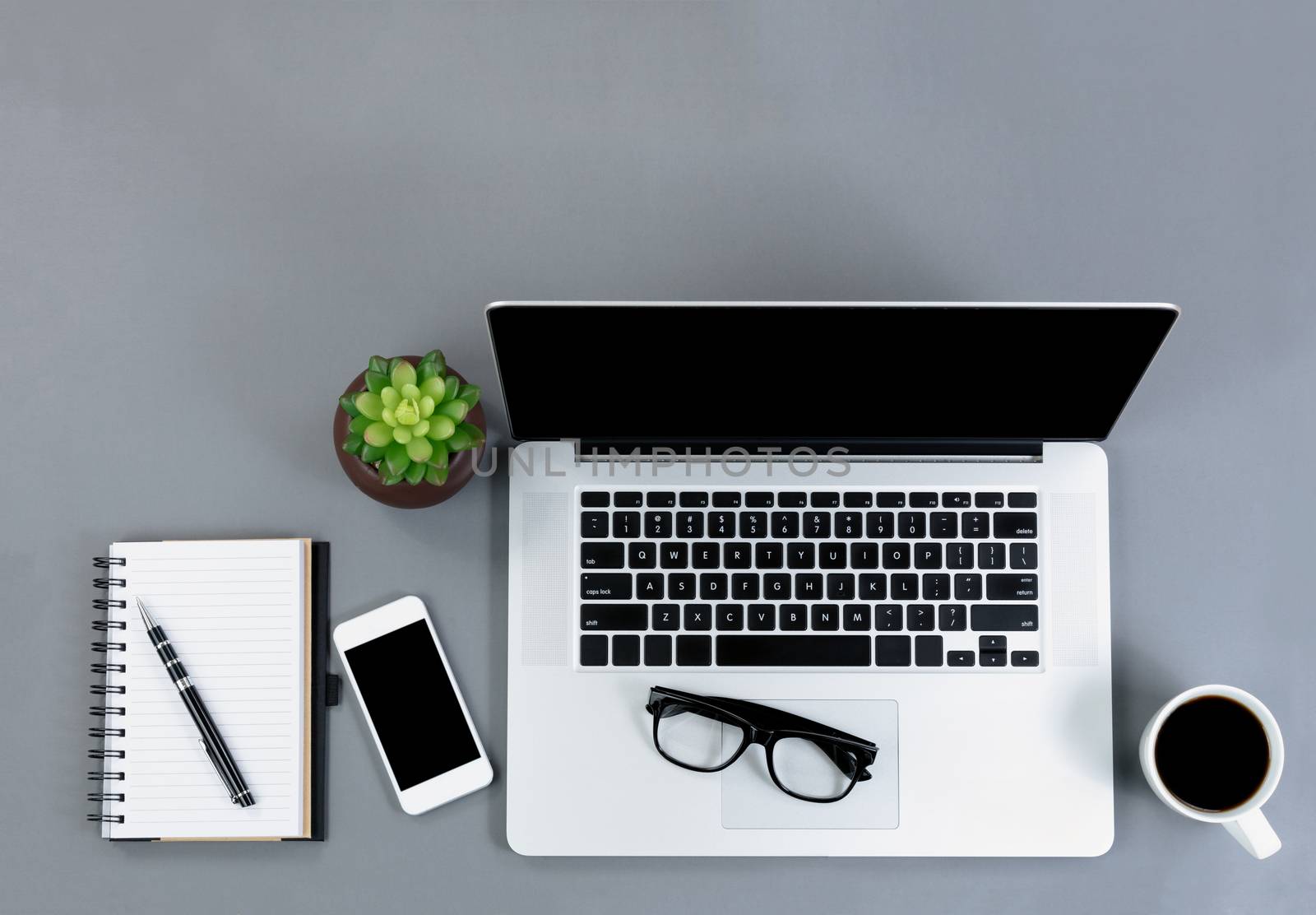 Overhead view of mobile functional gray desktop 