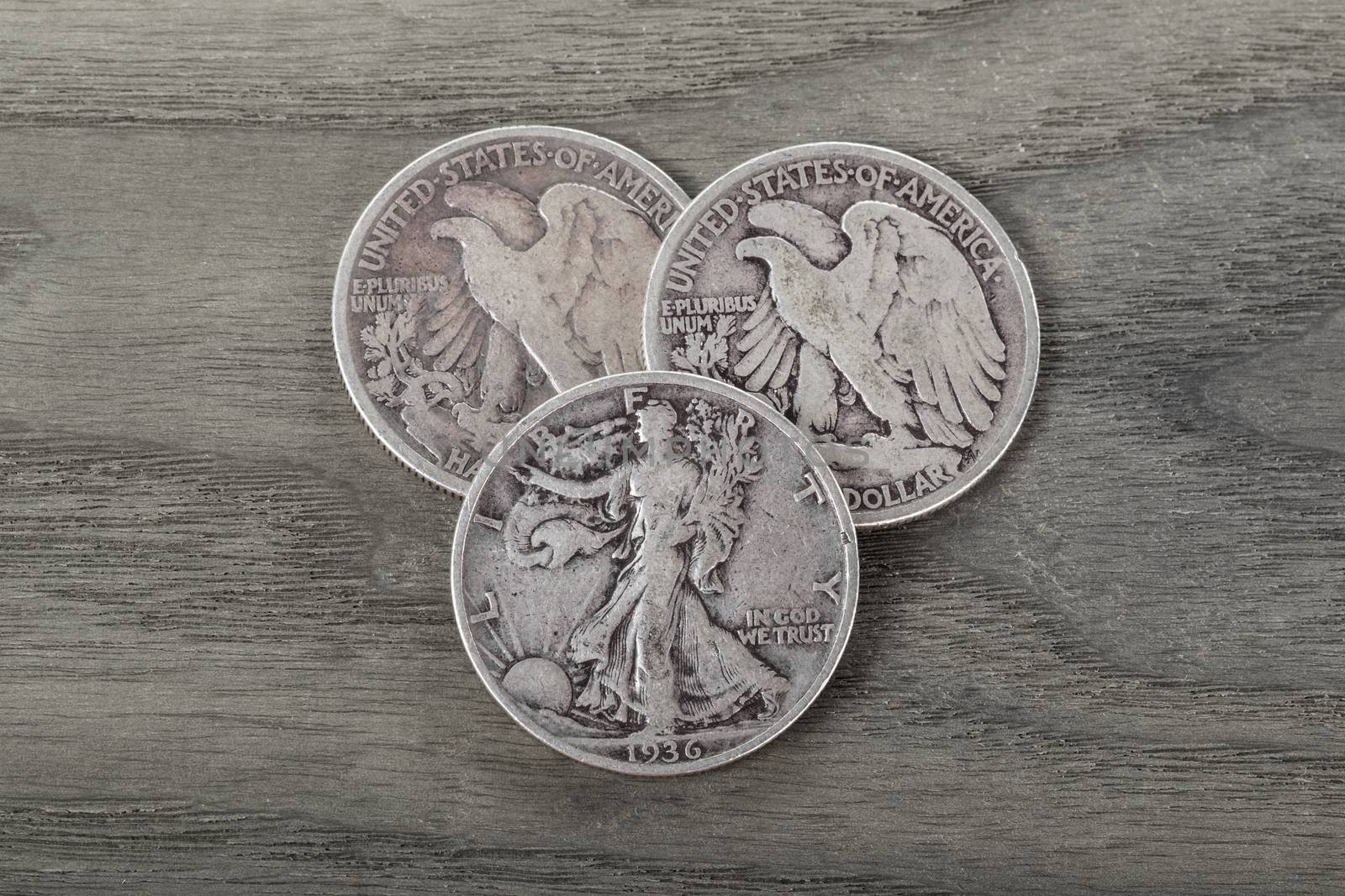 Silver Coins on Old Wood  by tab1962
