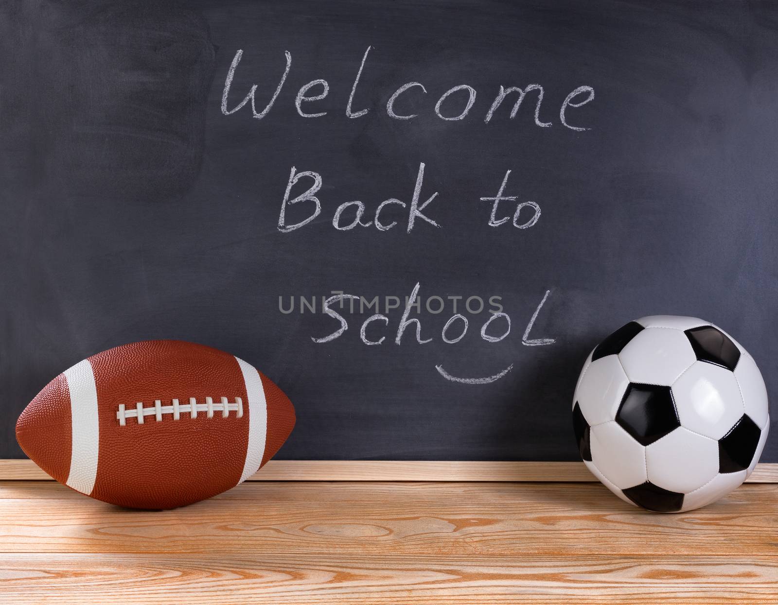 Sports equipment with black chalkboard in background  by tab1962