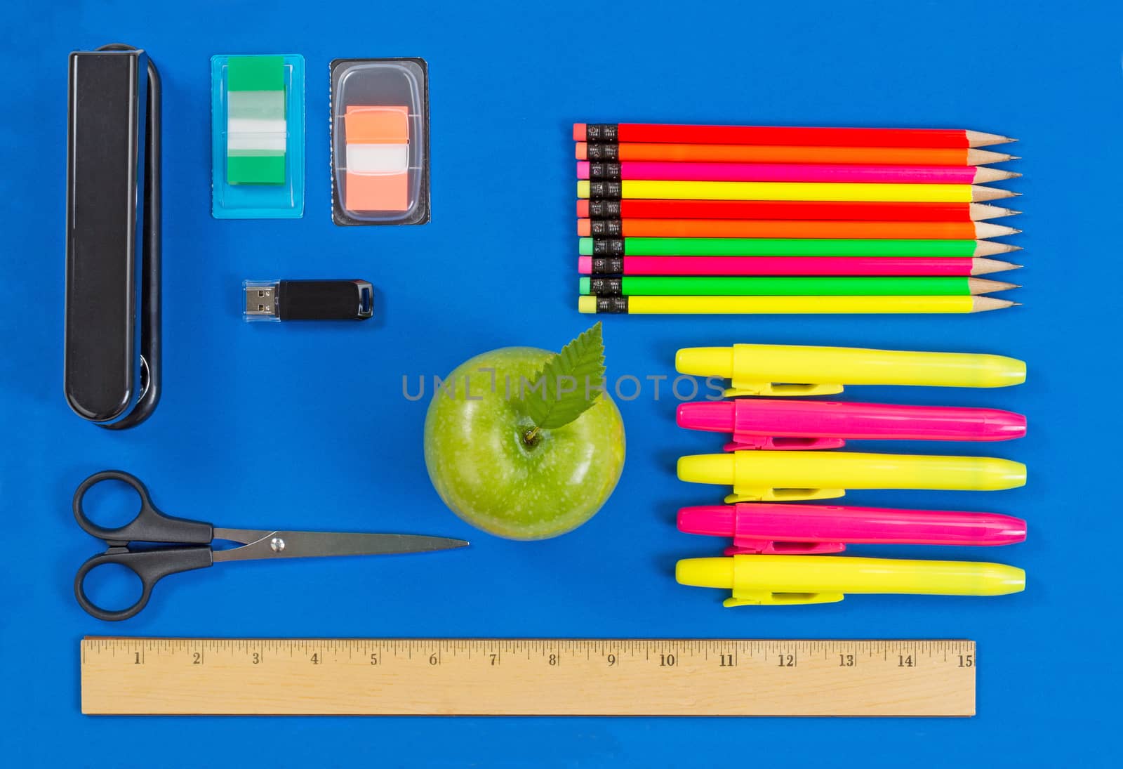 Basic supplies for office or back to school on blue background by tab1962