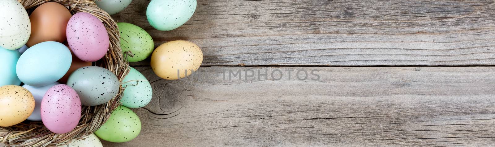 Easter eggs on rustic wooden background by tab1962