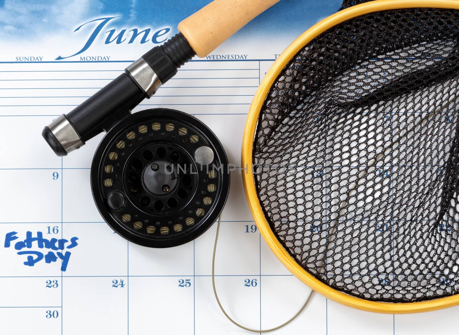 Fathers Day holiday marked on calendar with fishing equipment fo by tab1962