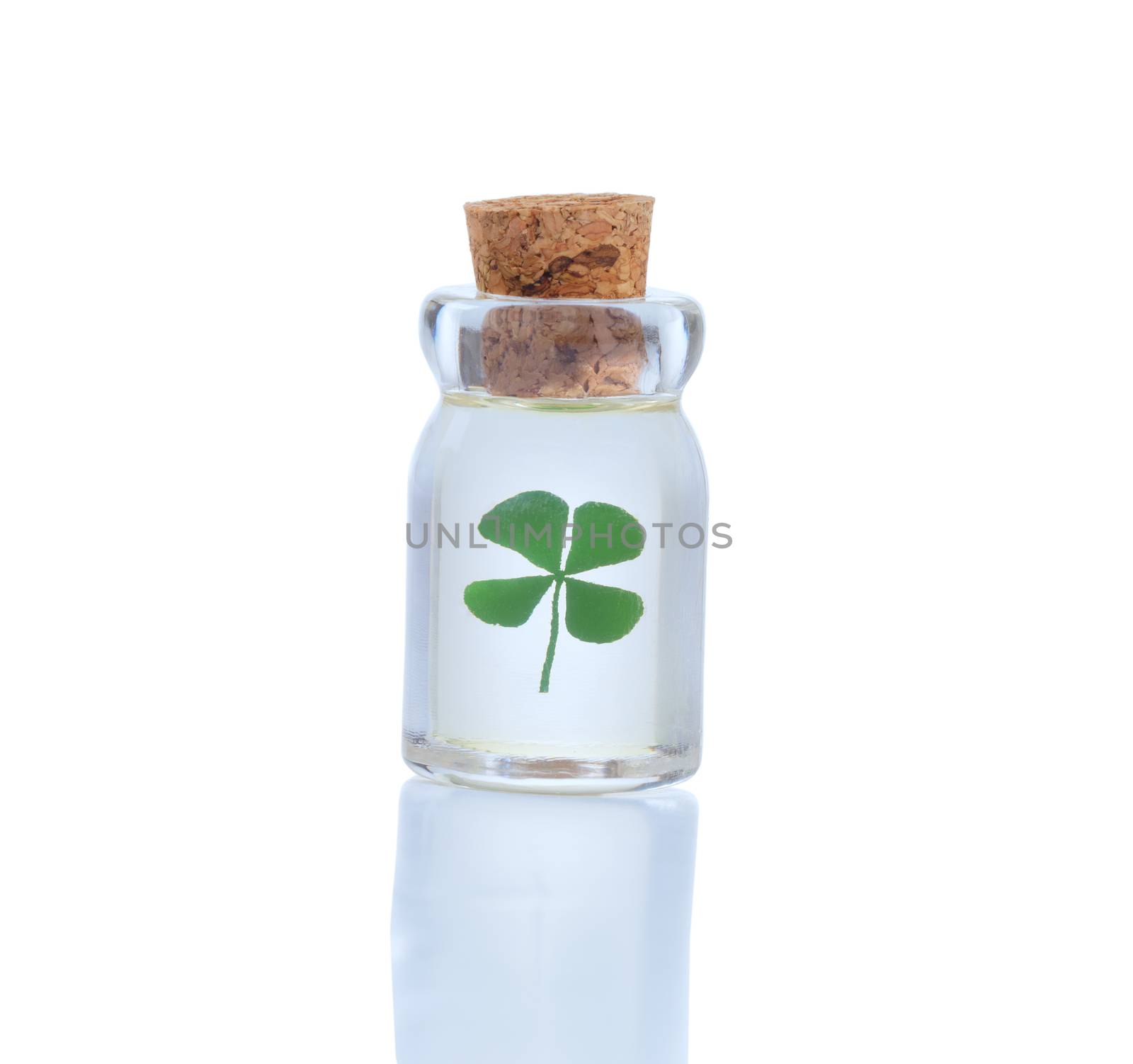 Four leaf clover in bottle for St. Patrick day symbol isolated o by tab1962