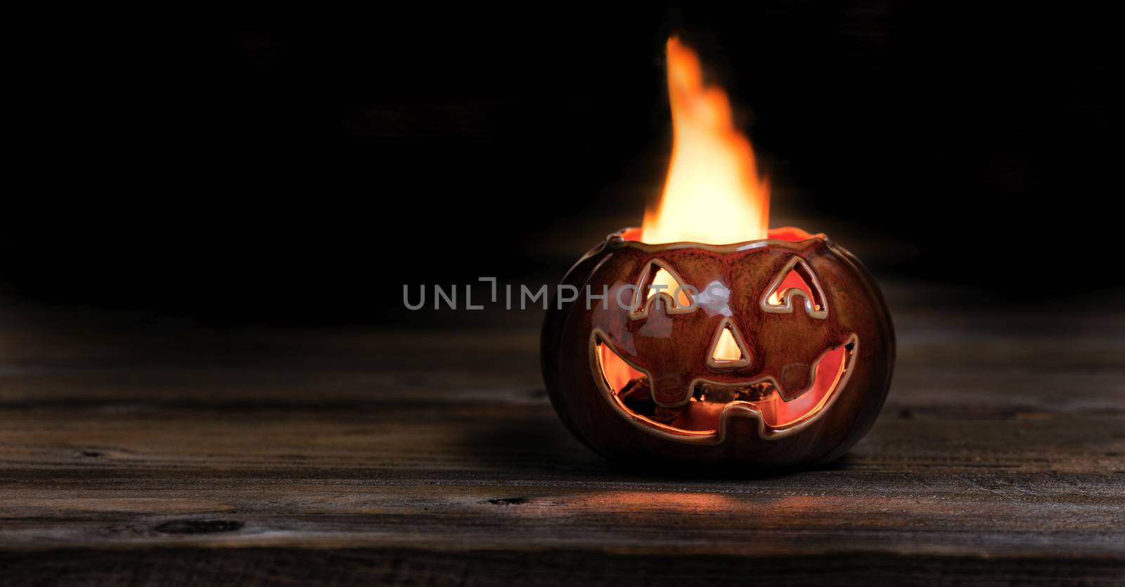 Halloween pumpkin on fire during the night time  by tab1962