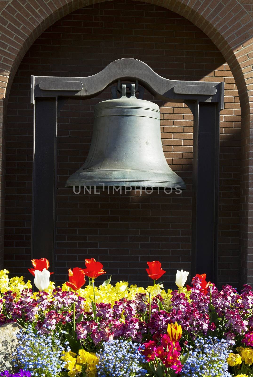Memorial Bell in Capital of Victoria Canada with Brick Wall in Background