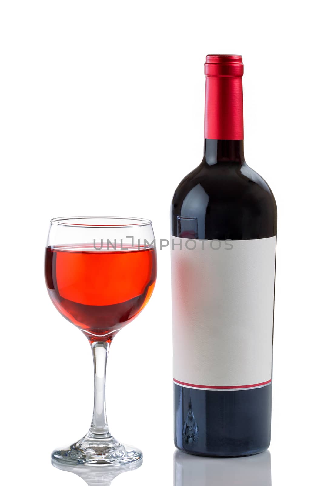 Red Wine in Glass next to full bottle on white background  by tab1962