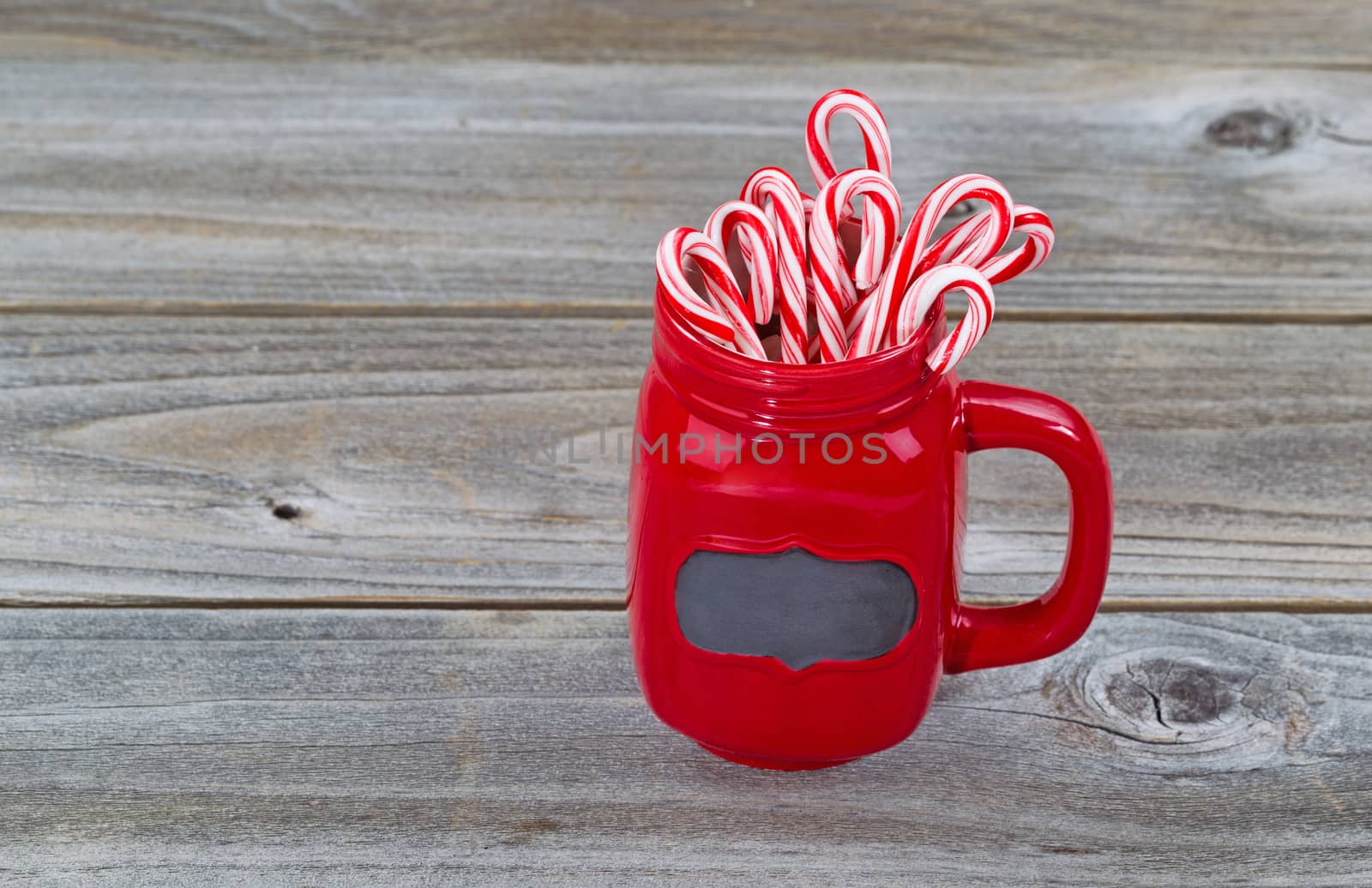 Red Cup filled with Candy Canes for the holiday season  by tab1962