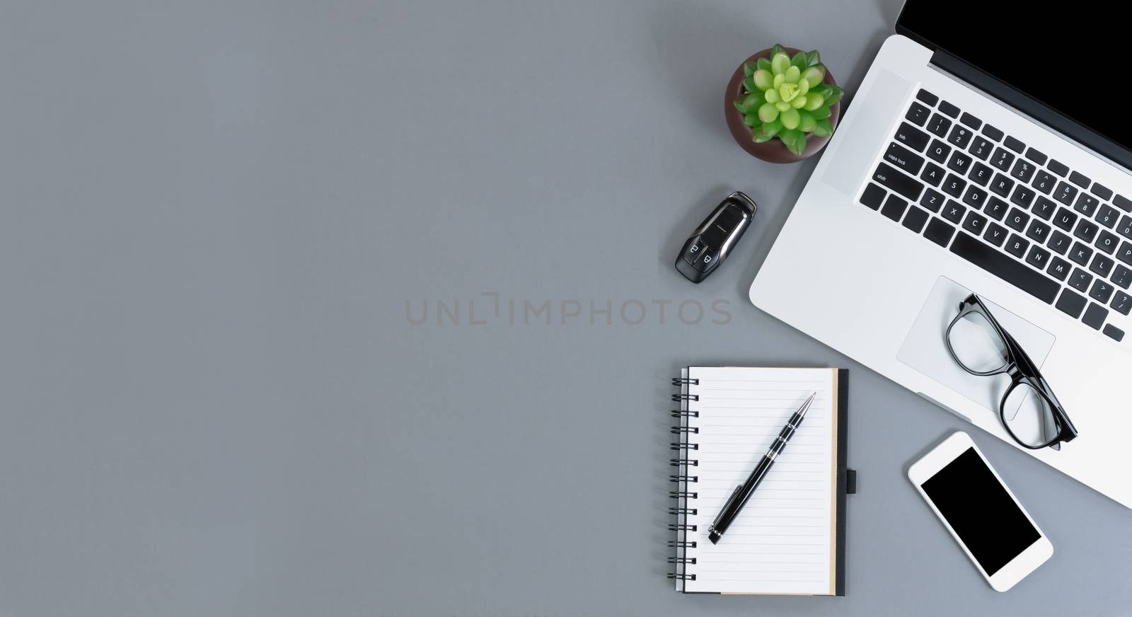 Flat lay view of gray desk with amply copy space  by tab1962