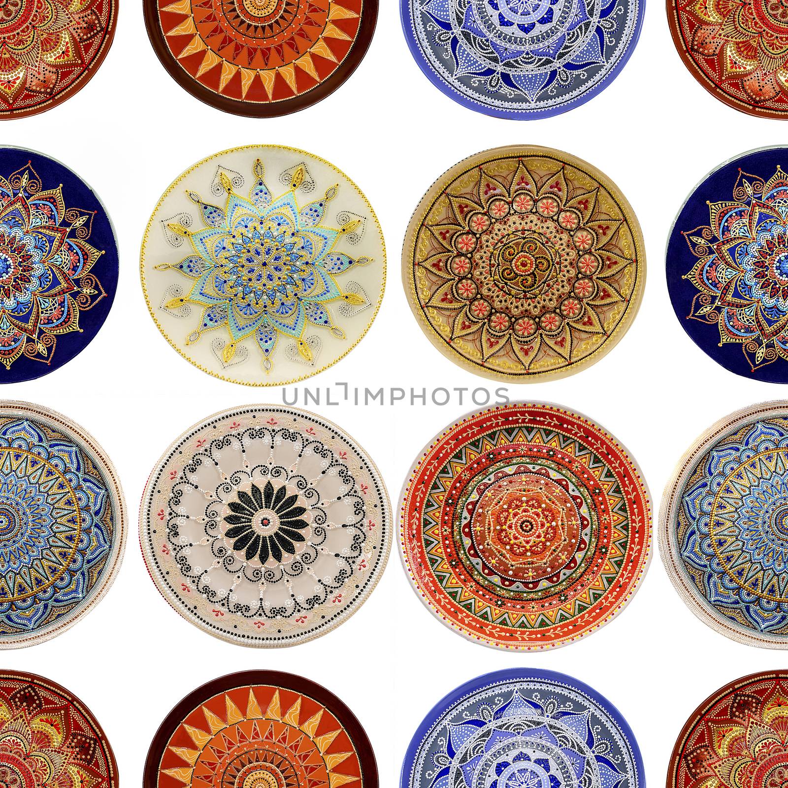 Seamless background from a set of decorative ceramic dishes hand-painted with acrylic paints with a floral pattern.