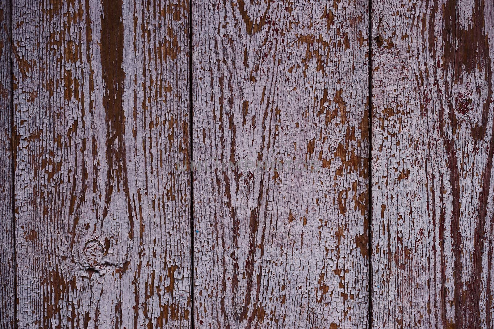 Old red wooden texured door surface closeup. Relief on surface.  by alexsdriver