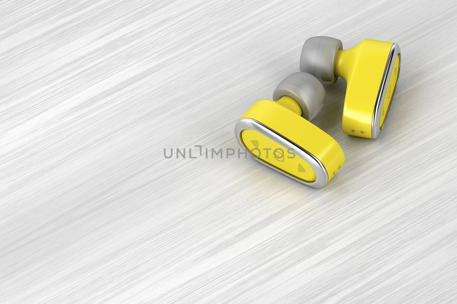 Yellow wireless in-ear headphones on wood table