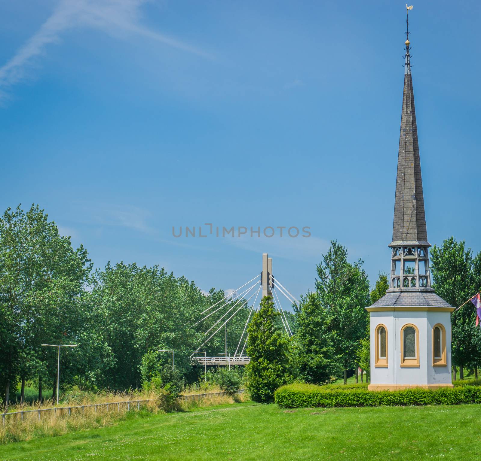 small white religious chapel church building up the hill