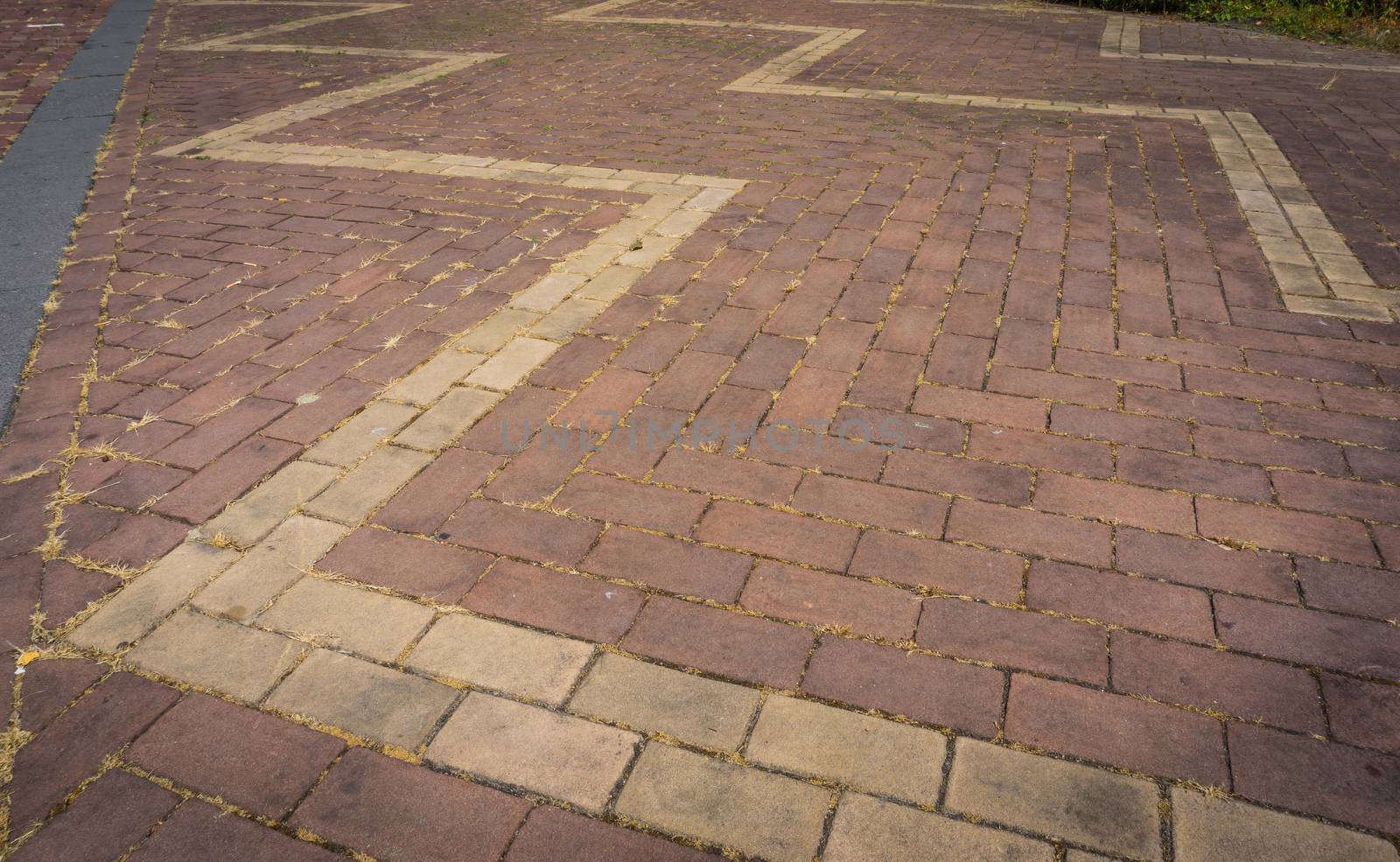 pavement brick pattern close up with zigzag by charlottebleijenberg