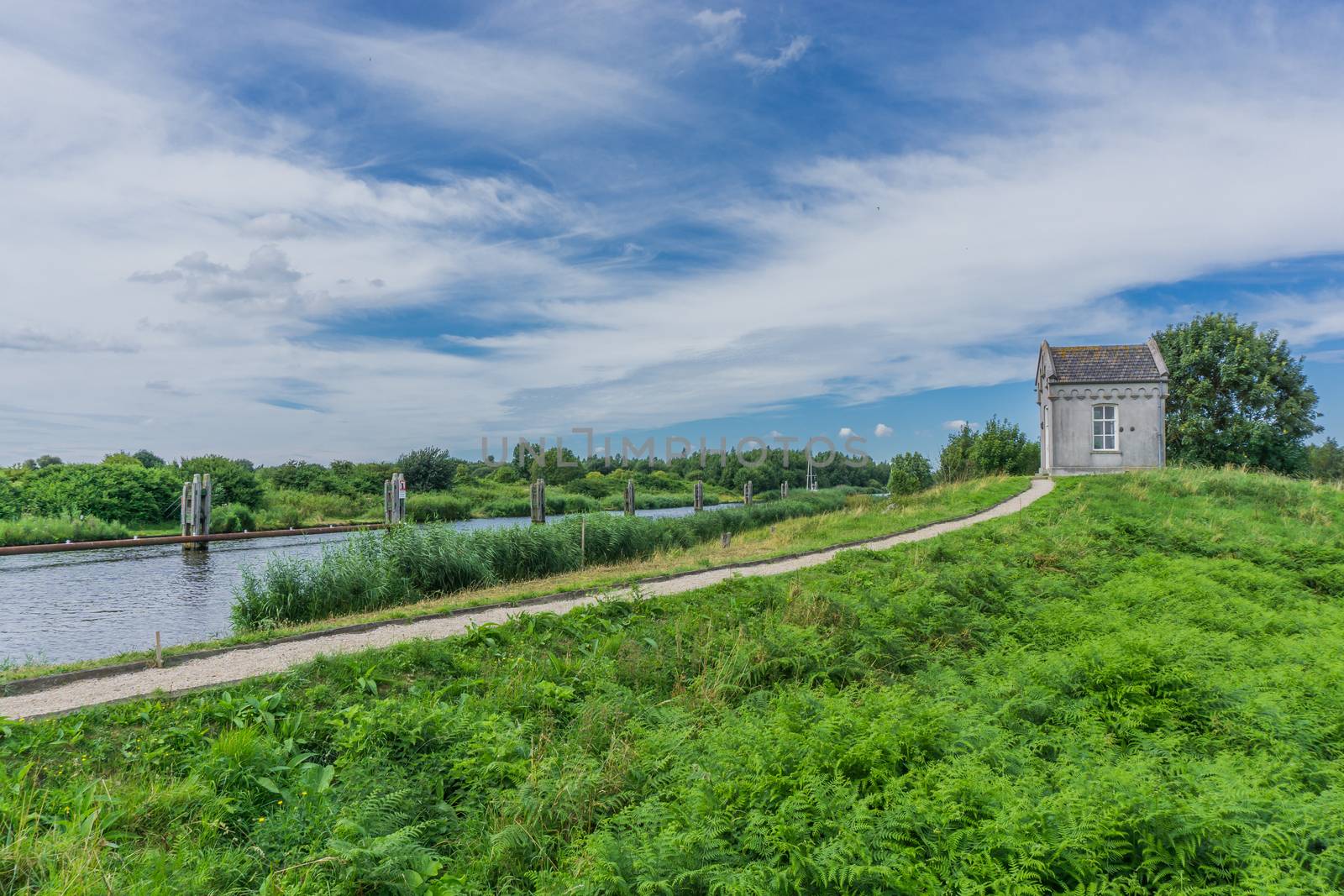 small house cottage building at the hill distance view by charlottebleijenberg