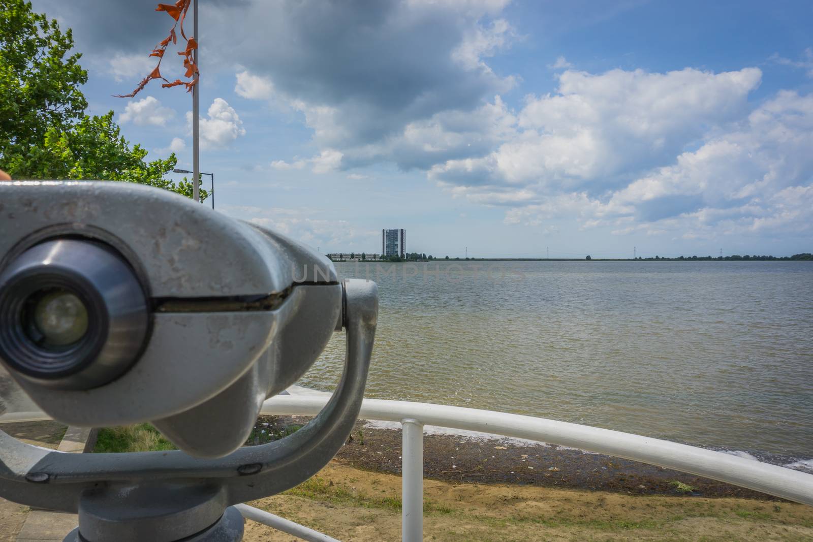 watch tower with binoculars at the city beach lake view by charlottebleijenberg