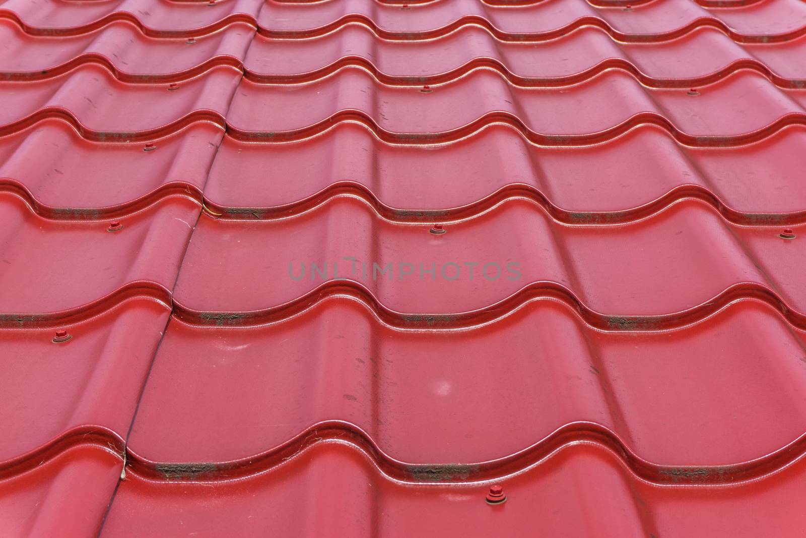 red glossy rooftop tiling in close up texture background