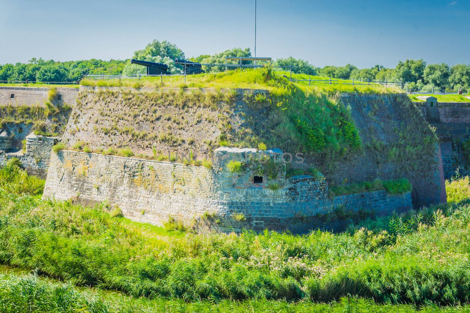 massive old wall with cannons in a beautiful landscape