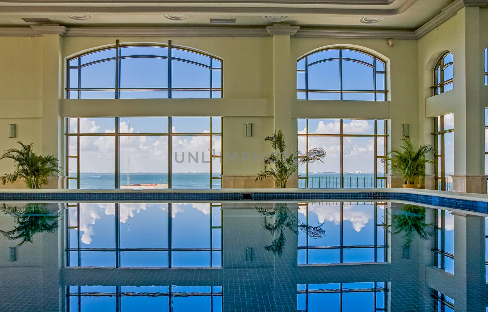 Indoor pool at a spa reflecting the light from outside