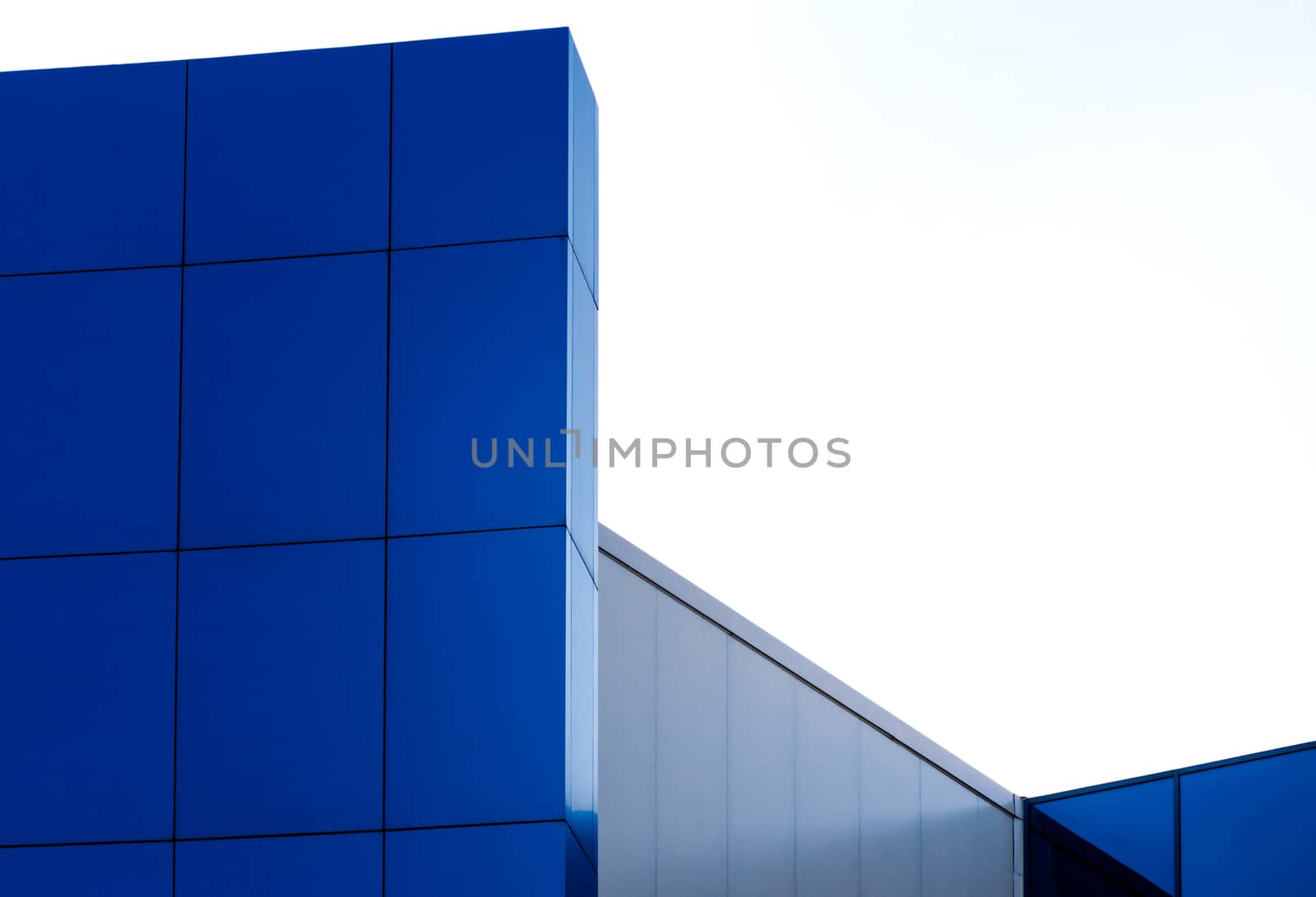 architectural abstract pattern fragment of a wall of blue modern building on a white background